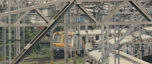 Wide shot frame from The Lunchbox — train