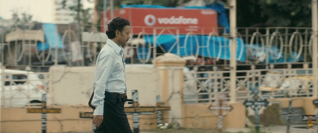 Wide shot frame from The Lunchbox — walking, street, shirt