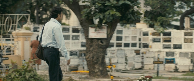 Wide shot frame from The Lunchbox — walking, street, shirt