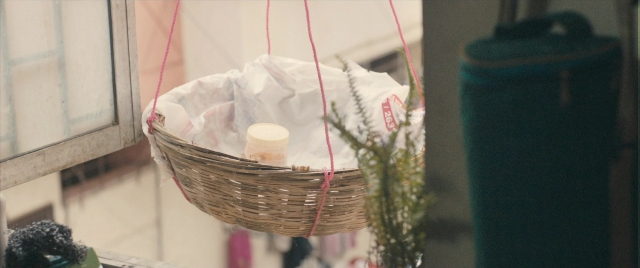 Frame from The Lunchbox — bag, window, picnic basket