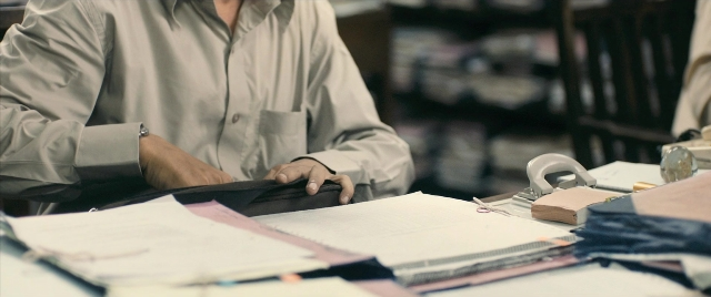 Frame from The Lunchbox — sitting, book, watch