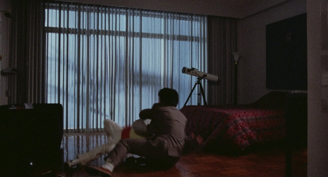 Frame from Fei lung mang jeung — sitting, room, bed