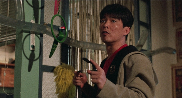 Wide shot frame from Fei lung mang jeung — standing, room, dialogue