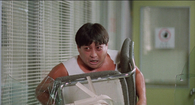 Frame from Fei lung mang jeung — sitting, room, bed