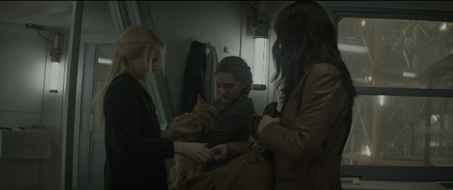 Wide shot frame from The Hunger Games: Mockingjay - Part 1 — standing, room, dialogue