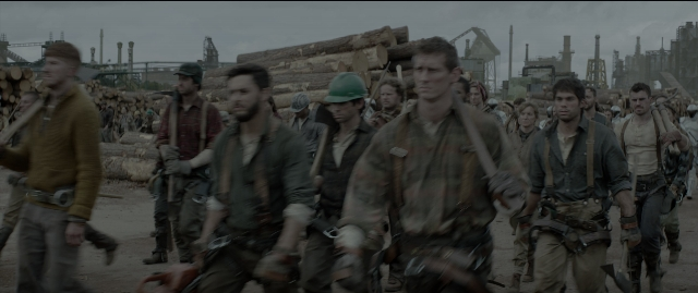 Wide shot frame from The Hunger Games: Mockingjay - Part 1 — walking, street, person