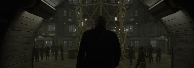 Wide shot frame from The Hunger Games: Mockingjay - Part 1 — standing, person, window
