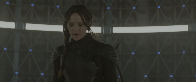 Wide shot frame from The Hunger Games: Mockingjay - Part 1 — standing, room, hair