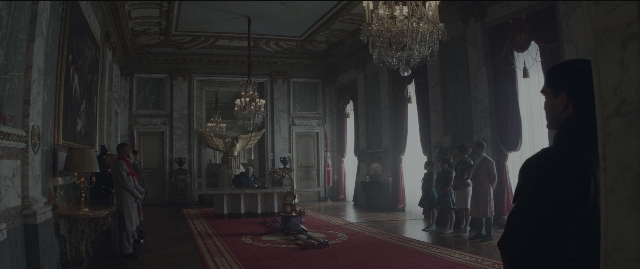 Wide shot frame from The Hunger Games: Mockingjay - Part 1 — standing, room, bird