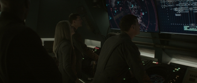 Wide shot frame from The Hunger Games: Mockingjay - Part 1 — standing, room, person