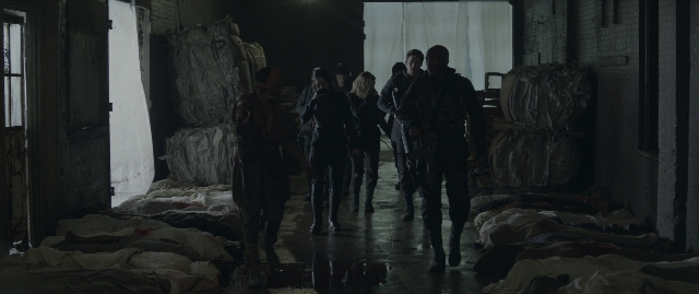 Wide shot frame from The Hunger Games: Mockingjay - Part 1 — walking, room, person