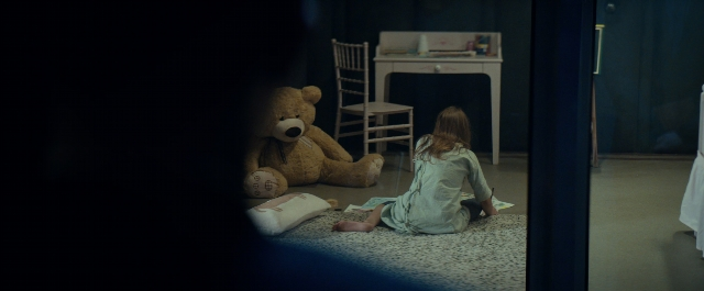 Frame from Prey for the Devil — sitting, room, table