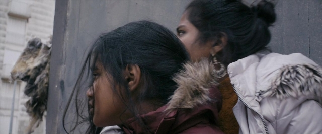 Frame from Dheepan — standing, face, hair