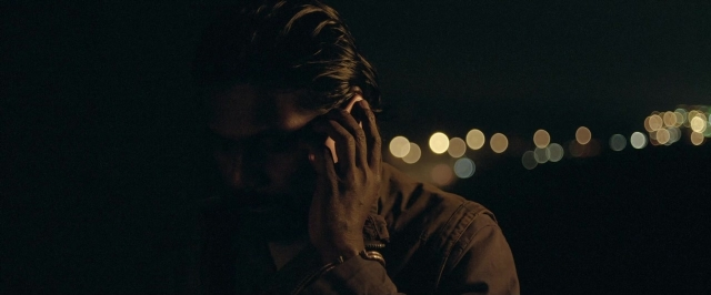 Wide shot frame from Dheepan — standing, hair, person