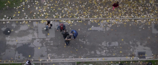 Wide shot frame from Dheepan — walking, street, person