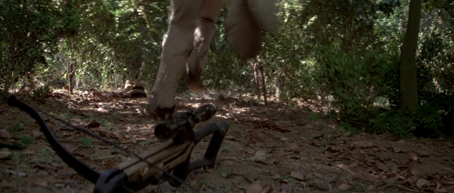 Wide shot frame from For Your Eyes Only — walking, hand, bicycle