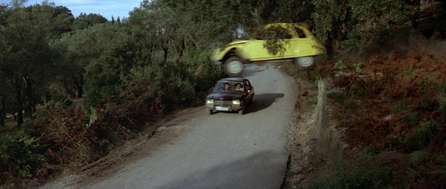 Frame from For Your Eyes Only — street, car, smoke