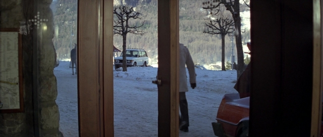 Wide shot frame from For Your Eyes Only — walking, room, door