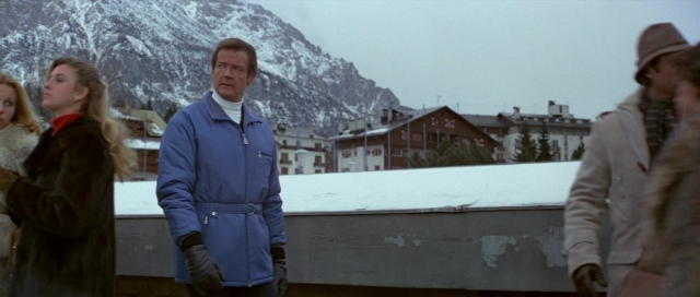 Wide shot frame from For Your Eyes Only — standing, coat, jacket