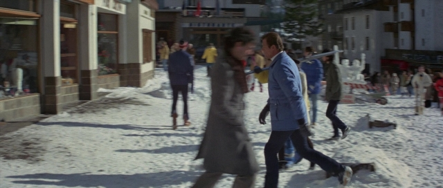 Wide shot frame from For Your Eyes Only — walking, dialogue, street