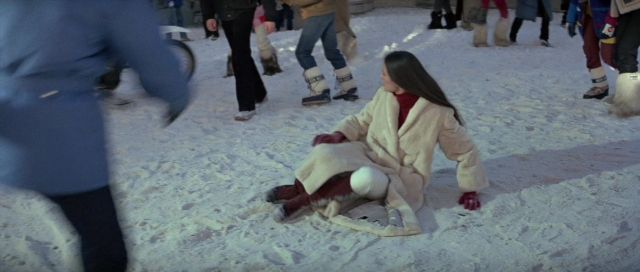 Wide shot frame from For Your Eyes Only — sitting, walking, street
