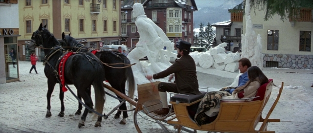 Wide shot frame from For Your Eyes Only — sitting, street, horse