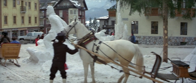 Wide shot frame from For Your Eyes Only — standing, walking, street