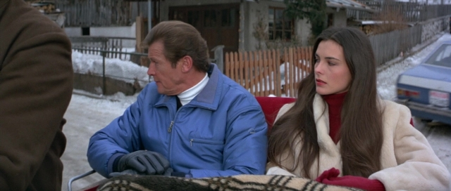 Wide shot frame from For Your Eyes Only — sitting, dialogue, street