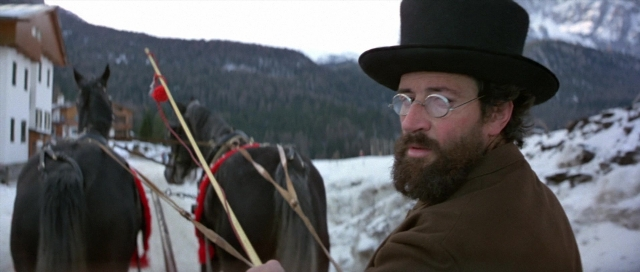 Frame from For Your Eyes Only — standing, hat, coat