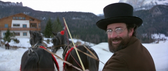Wide shot frame from For Your Eyes Only — standing, hat, coat