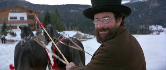 Wide shot frame from For Your Eyes Only — standing, hat, coat