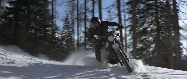 Wide shot frame from For Your Eyes Only — hat, smoke, snow