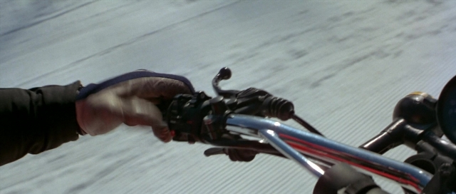 Frame from For Your Eyes Only — hand, bicycle, person