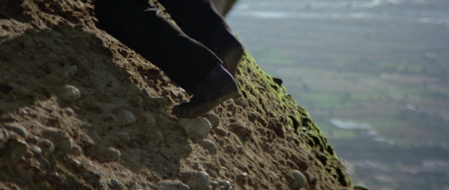 Wide shot frame from For Your Eyes Only — standing, person, footwear