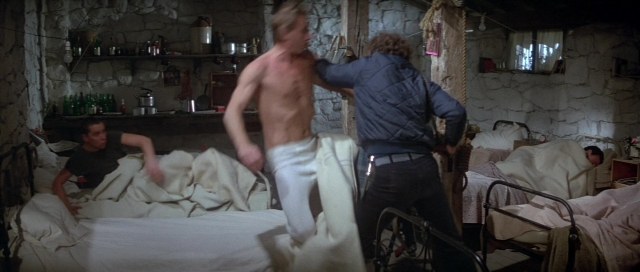 Wide shot frame from For Your Eyes Only — standing, room, bed