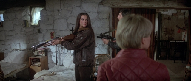 Wide shot frame from For Your Eyes Only — standing, room, bed