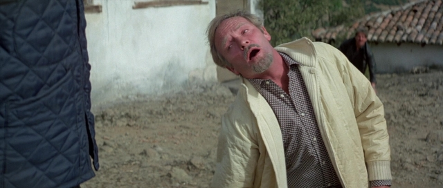 Wide shot frame from For Your Eyes Only — standing, shirt, smoke