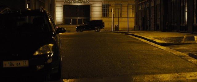 Wide shot frame from Jack Ryan: Shadow Recruit — door, street, car