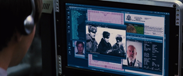 Wide shot frame from Jack Ryan: Shadow Recruit — sitting, room, suit
