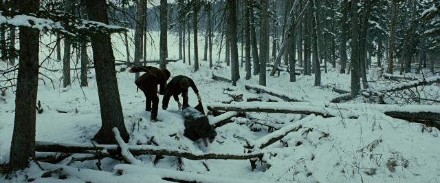 Wide shot frame from The Assassination of Jesse James by the Coward Robert Ford — animal, dog, forest