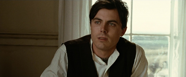 Medium shot frame from The Assassination of Jesse James by the Coward Robert Ford — room, shirt, face