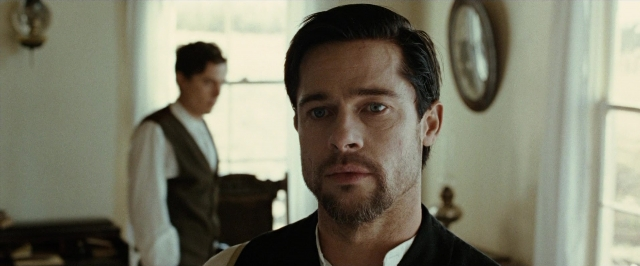 Medium shot frame from The Assassination of Jesse James by the Coward Robert Ford — standing, room, shirt