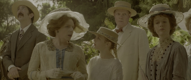 Wide shot frame from Jungle Cruise — standing, dialogue, hat