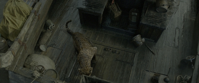 Wide shot frame from Jungle Cruise — room, animal, door