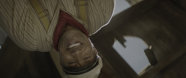 Wide shot frame from Jungle Cruise — room, shirt, face