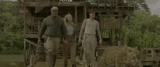 Wide shot frame from Jungle Cruise — walking, leopard, person