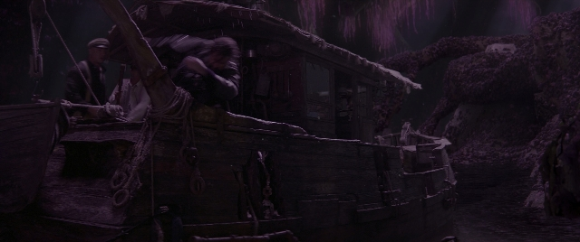 Wide shot frame from Jungle Cruise — standing, boat, person