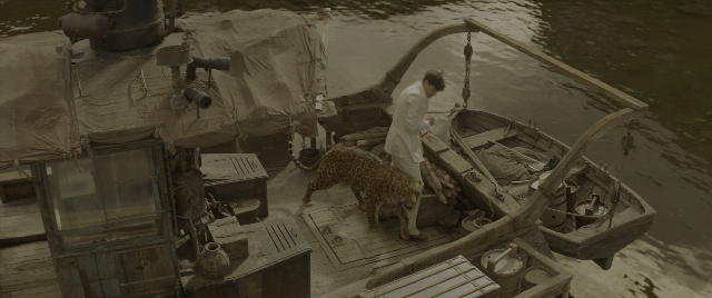 Wide shot frame from Jungle Cruise — standing, walking, door