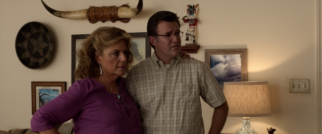 Wide shot frame from 21 Jump Street — standing, room, table