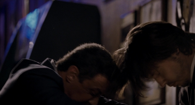 Frame from Bullet to the Head — room, kiss, hand